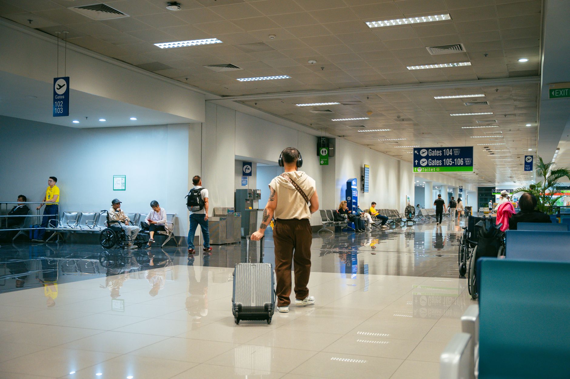 traveler with luggage kuala lumpur airport