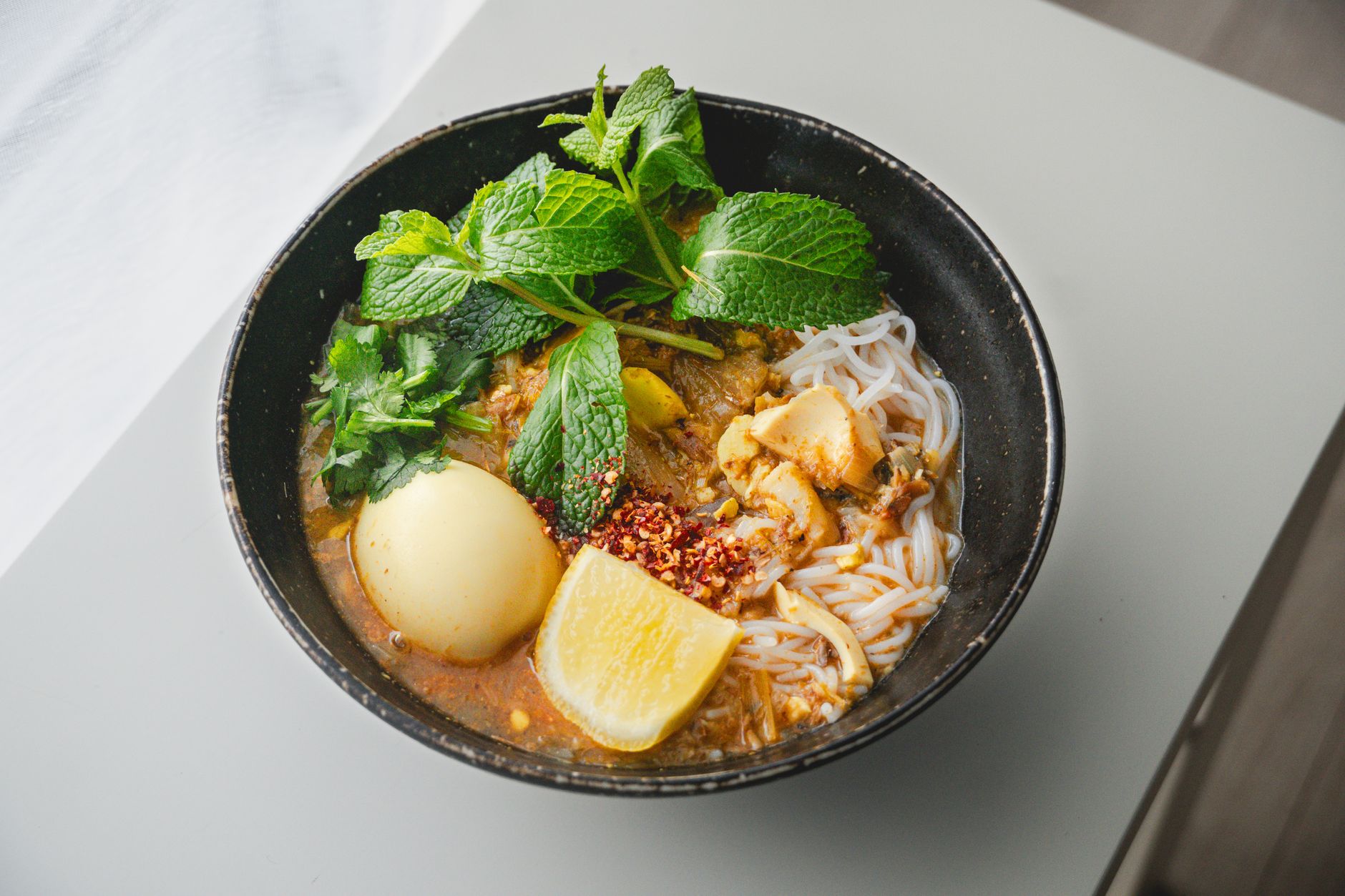 malaysian curry laksa noodle bowl closeup
